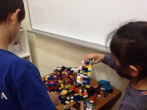 Two of my students building the LEGO model of the playground.